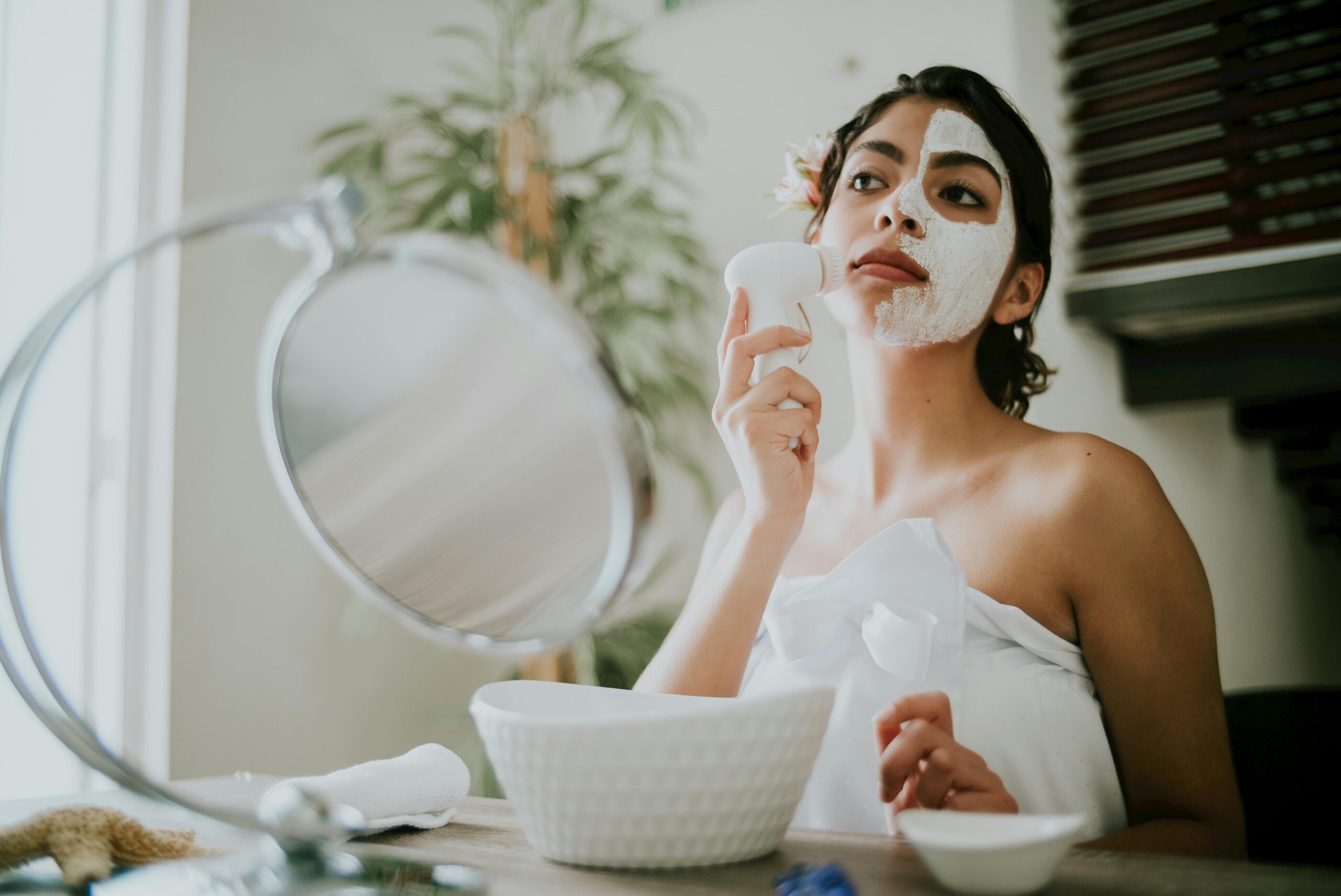 A woman with glowing skin practicing natural ways to boost collagen in your skin.